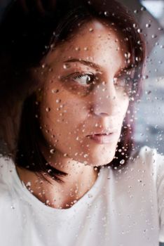 conceptual portrait of stressed abused young woman 