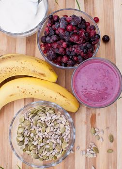 healthy berries juice smootie on wooden board