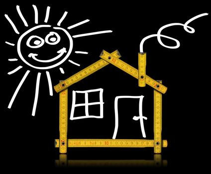 Yellow meter tool forming a house with sun, door and window on black background
