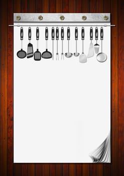 Notebook with blank pages and kitchen utensils for recipes or menu on wooden wall
