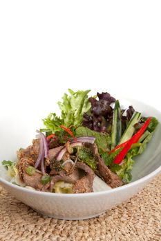 Asian style Thai salad with steak and fresh vegetables.