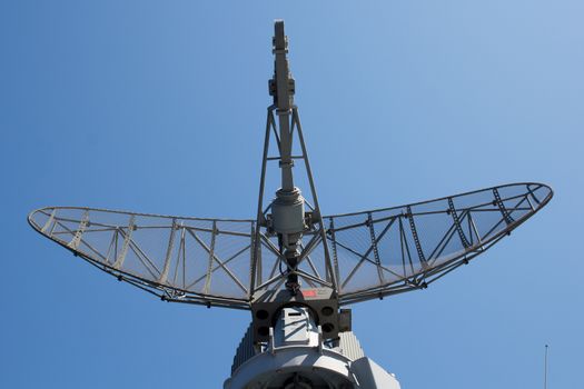  Modern military ship radar station against the sky