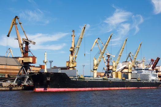 dry cargo ship in port  waiting for coal loading