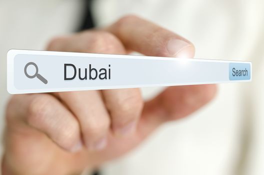 Word Dubai written in search bar on virtual screen.