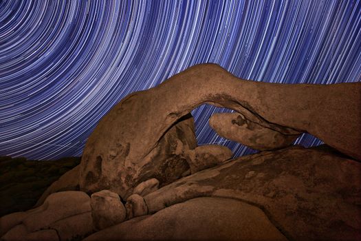 Star Trail Streaks over the Rocks of Joshua Tree Park