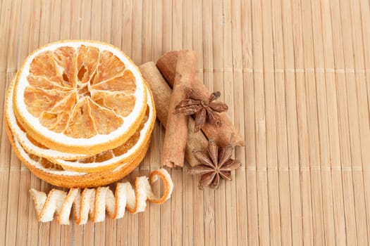 detail of Star Anise, cinnamon and dried orange  on wooden background 