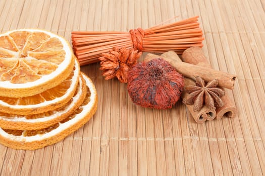 detail of Star Anise, cinnamon and dried orange  on wooden background 