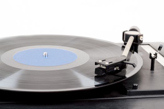 Spinning vinyl record. Motion blur image.  Vintage toned. Shallow depth of field.
