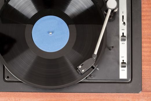Spinning vinyl record. Motion blur image.  Vintage toned. Shallow depth of field.