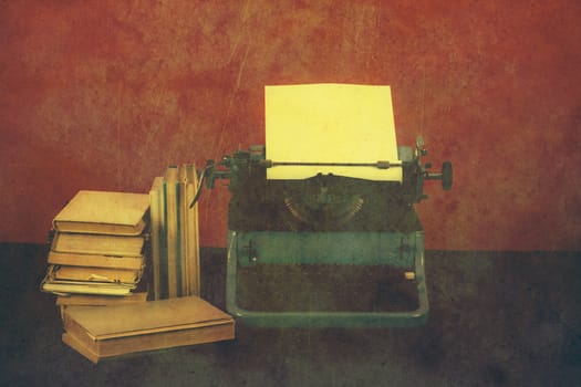 Old typewriter with paper and books, retro colors on the desk