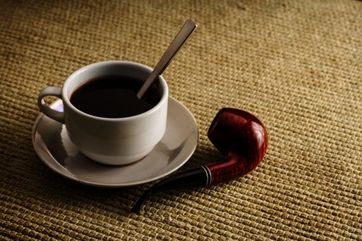 A cup of coffee with a pipe in high resolution