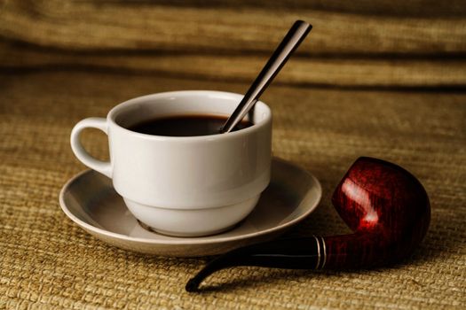 A cup of coffee with a pipe in high resolution