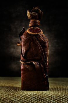 Brown leather vintage bottle on a dark background in high resolution