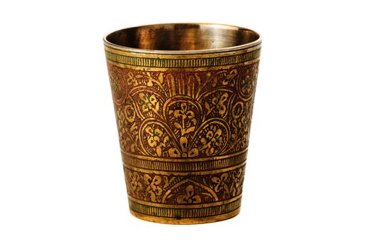 Bronze yellow cup with ornament on a white background
