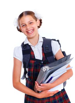 Education theme. Joyful schoolgirl smiling happily with backpack and book. Isolated on white background