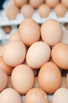 Background of Raw Fresh Eggs For Sale at a Farmers Market, vertical shot