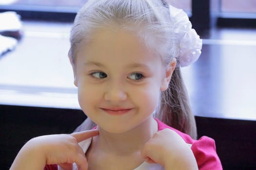 Portrait of beautiful girl with blue eyes