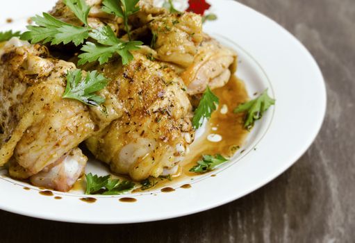 Grilled Chicken legs with sauce and parsley