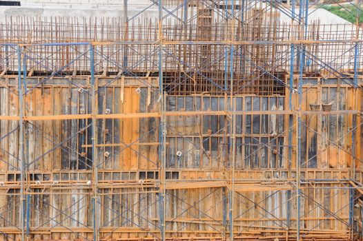View of a metal scaffolding by work on dam construction site, Thailand.