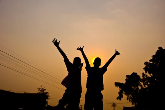 silhouette of boy feel free and happy