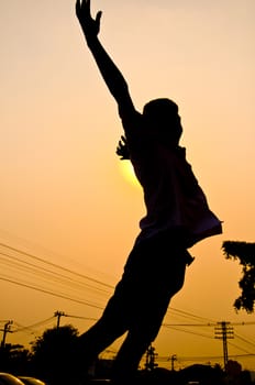 silhouette of boy feel free and happy