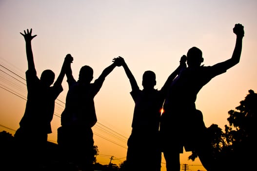 silhouette of boy feel free and happy