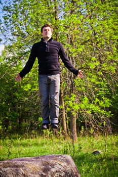 Happy Man floating in the middle of nature