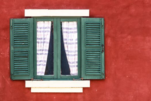 Old Green Window with Curtain on Red Wall,  Copy Space on Right