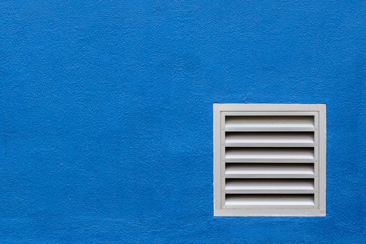 White Vent on Blue Concrete Wall