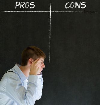 Businessman, student or teacher thinking pros and cons decision list chalk concept blackboard background