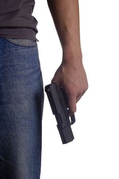 Gun in the man's hand by his hip.