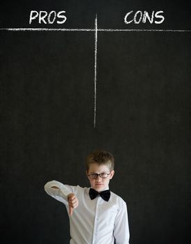 Thumbs down boy dressed up as business man with chalk pros and cons decision list on blackboard background
