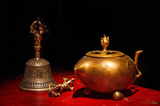 Tibetan Buddhist still life - vajra, bell, water vessel. Hemis gompa, Ladakh, India.