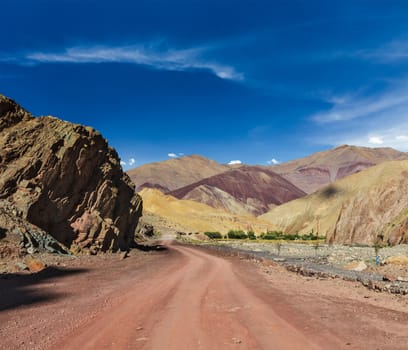 Travel forward concept background - road Himalayas with mountains. Manali-Leh road, Ladakh, Jammu and Kashmir, India