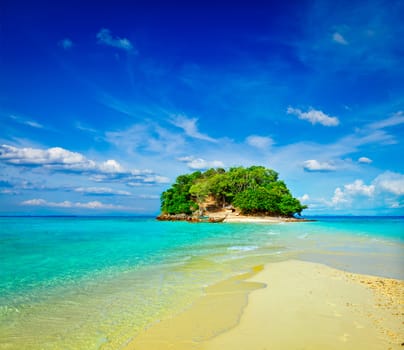 Vacation holidays concept background - tropical island and long-tail boat in sea. Thailand