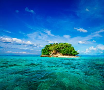 Vacation holidays concept background - tropical island and long-tail boat in sea. Thailand