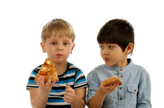 One Little Boy Eating Pizza and Another Boy Interesting about Kind of Pizza