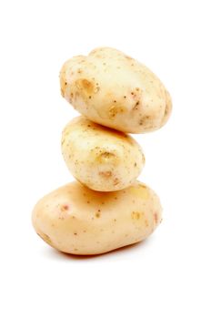 Stack of Three Raw New Harvest Potato isolated on white background