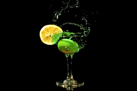 Green cocktail splash with a slice of citron