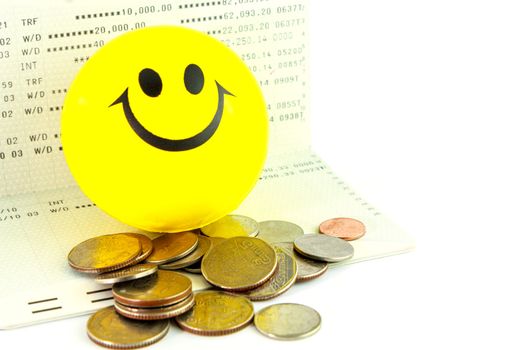 Coins on account passbook with smile ball,Thai bath