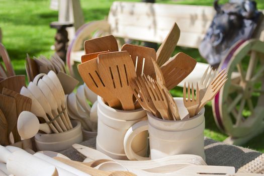 Carved wooden dishware handmade by Belarusian artists close up