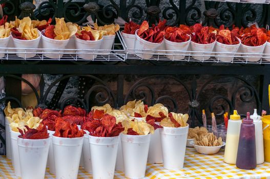 Red and yellow potato chips being sold from a stall in Mexico City