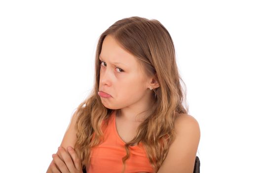 Angry child make a grimace. Isolated on a white background.