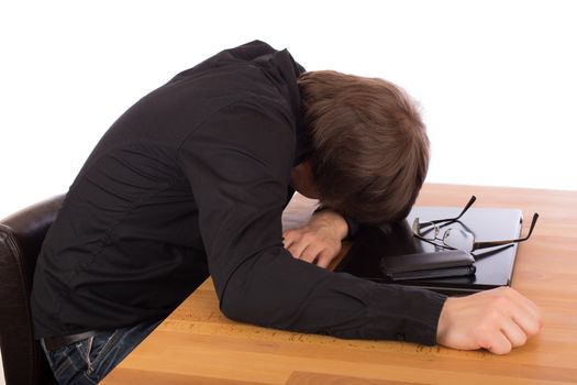 Business man sleep on his laptop. Isolated on a white background.