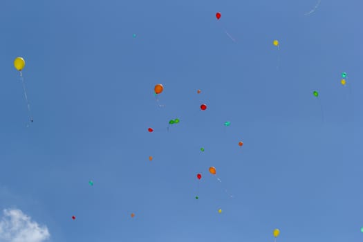 color balloons flying to the sky