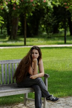 pretty young girl on a bench