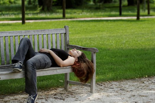 pretty young girl couch on a bench