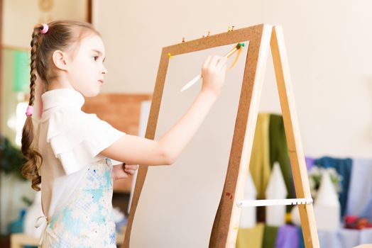 portrait of a girl standing next to his easel, a drawing lesson