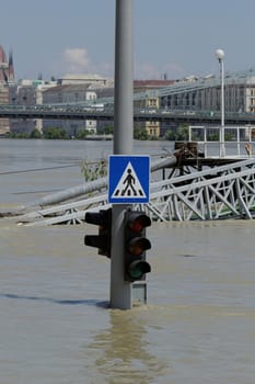 traffic light on flooding river