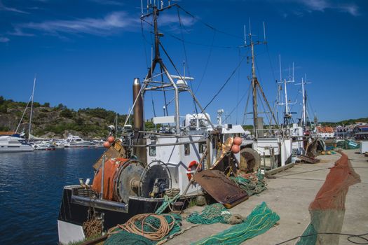 The fishing boats is moored to the docks in Grebbestad, Sweden.